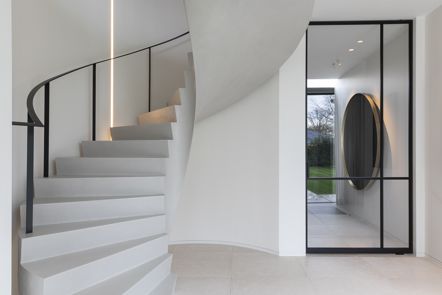 A spiral staircase in a modern home.